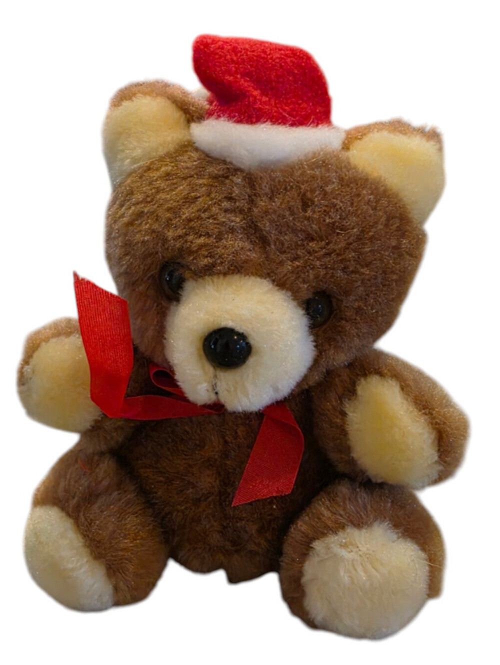 Vintage brown plush teddy bear wearing a tiny red Santa hat by RUSS